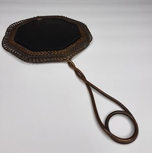 Antique twisted hand mirror. Brass or Bronze.